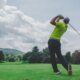 male golfer teeing off at one of the golf courses in the Kawartha Lakes region