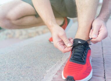 runner lacing up their shoe in preparation for the Fenelon Falls Turkey Trot race in Kawartha Lakes