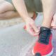 runner lacing up their shoe in preparation for the Fenelon Falls Turkey Trot race in Kawartha Lakes